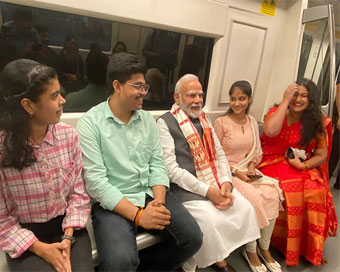 PM Modi takes metro on his way to DU, interacts with youngsters